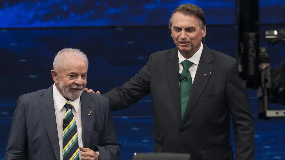 Lula e Bolsonaro durante debate na TV / Reprodução / TV Band
